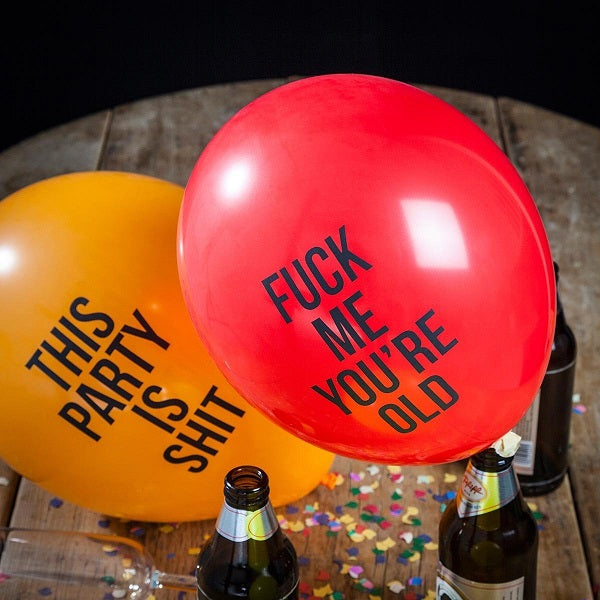 abusive party balloons on a table